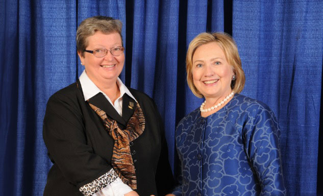 Nadia Jastrjembskaia and Hilary Clinton at American Society of Travel Agents Convention. Miami, 2013.